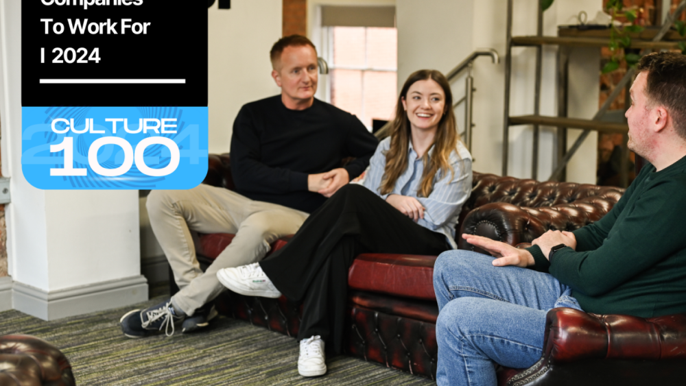 People on a sofa talking and laughing