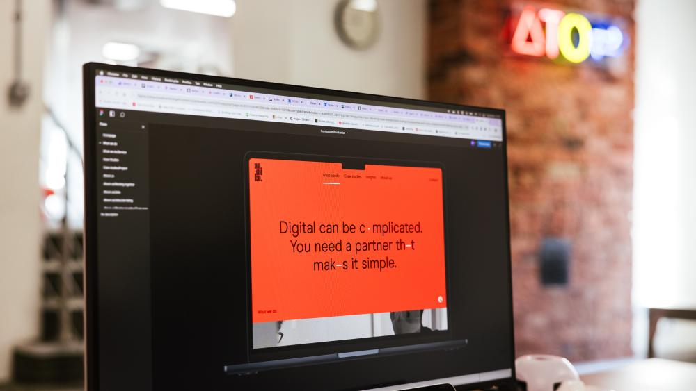 computer screen in office showing a website being designed 