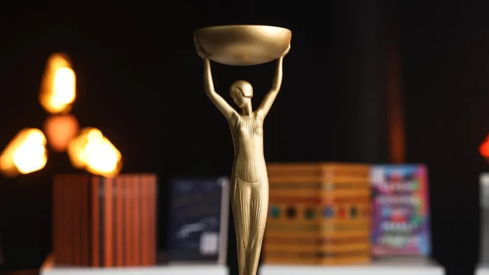 The trophy of the booker prizes, it's a bronze woman holding a bowl above her head