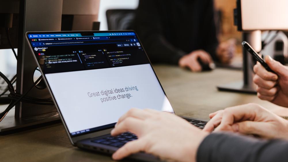 Laptop displaying the coding of a website
