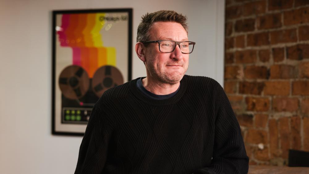 Dave posing for a headshot in the numiko office