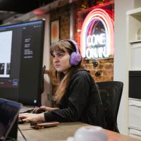 Aurora working at a desk in the Numiko office
