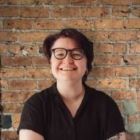 Soph posing for a headshot in the Numiko office