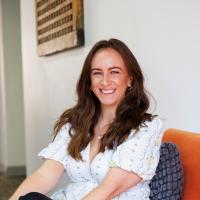 Marie posing for a headshot in the Numiko office